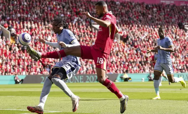 Liverpool's Cody Gakpo kicks the ball during the English Premier League soccer match between Liverpool and Tottenham Hotspur at Anfield in Liverpool, England, Sunday, April 27, 2025. (AP Photo/Jon Super)