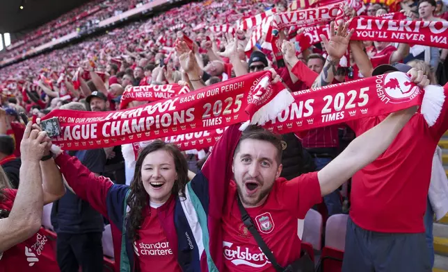 Liverpool supporters react before the English Premier League soccer match between Liverpool and Tottenham Hotspur at Anfield in Liverpool, England, Sunday, April 27, 2025. (AP Photo/Jon Super)