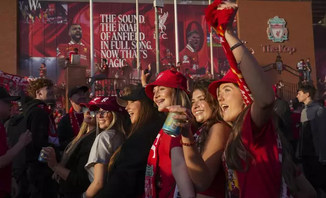Liverpool supporters celebrate outside of Anfield stadium after their team won English Premier League soccer match against Tottenham Hotspur and clinched the Premier League title in Liverpool, England, Sunday, April 27, 2025. (AP Photo/Jon Super)