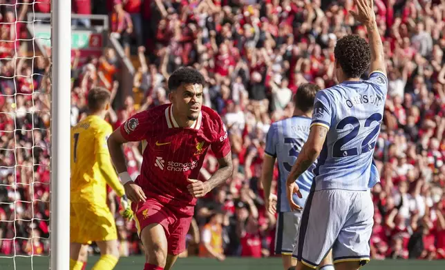 Liverpool's Luis Diaz scores his side's first goal during the English Premier League soccer match between Liverpool and Tottenham Hotspur at Anfield in Liverpool, England, Sunday, April 27, 2025. (AP Photo/Jon Super)
