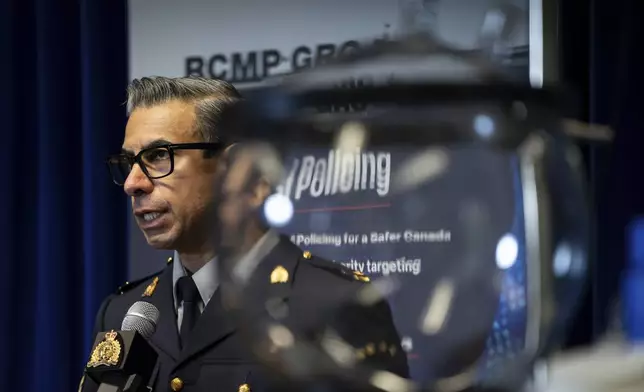 Constable Arash R. Seyed speaks during aRoyal Canadian Mounted Police (RCMP) news conference announcing fentanyl production labs that have been dismantled around British Columbia, in Surrey, British Columbia, Thursday, April 10, 2025. (Ethan Cairns/The Canadian Press via AP)