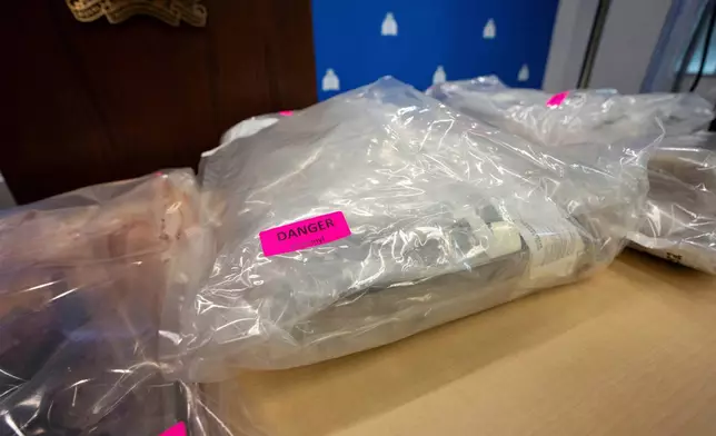 Fentanyl is pictured in evidence bags during a Royal Canadian Mounted Police (RCMP) news conference announcing fentanyl production labs that have been dismantled around British Columbia, in Surrey, British Columbia, Thursday, April 10, 2025. (Ethan Cairns/The Canadian Press via AP)