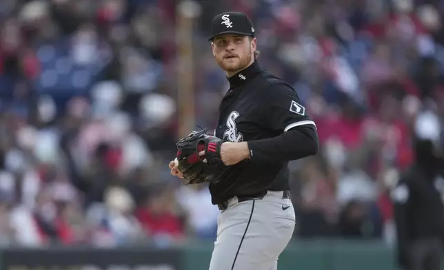 Chicago White Sox pitcher Shane Smith looks to first base and Cleveland Guardians' José Ramírez after Ramírez hit a single in the sixth inning of a baseball game in Cleveland, Tuesday, April 8, 2025. (AP Photo/Sue Ogrocki)