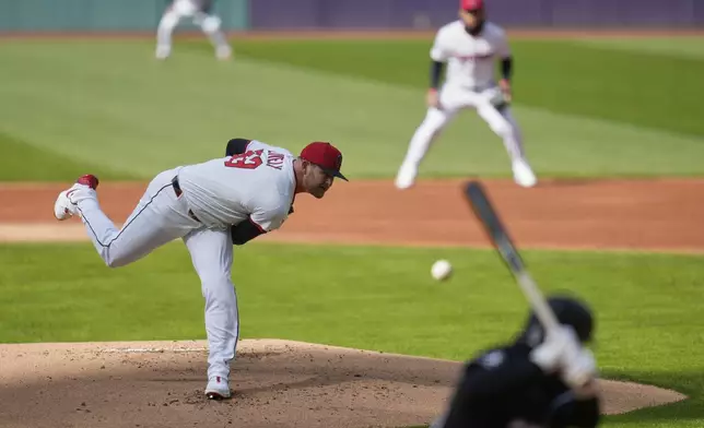 Cleveland Guardians pitcher Ben Lively (39) pitches to Chicago White Sox's Andrew Vaughn, right, in the first inning of a baseball game in Cleveland, Tuesday, April 8, 2025. (AP Photo/Sue Ogrocki)