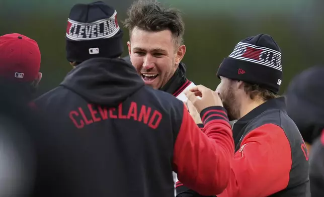 Cleveland Guardians' Nolan Jones celebrates with teammates after walking and bringing in the winning run in the ninth inning of a baseball game against the Chicago White Sox in Cleveland, Tuesday, April 8, 2025. (AP Photo/Sue Ogrocki)