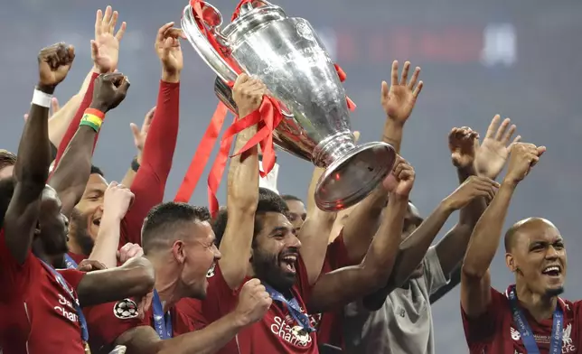 FILE - Liverpool's Mohamed Salah lifts the trophy after winning the Champions League final soccer match between Tottenham Hotspur and Liverpool at the Wanda Metropolitano Stadium in Madrid, on June 2, 2019. (AP Photo/Felipe Dana, File)