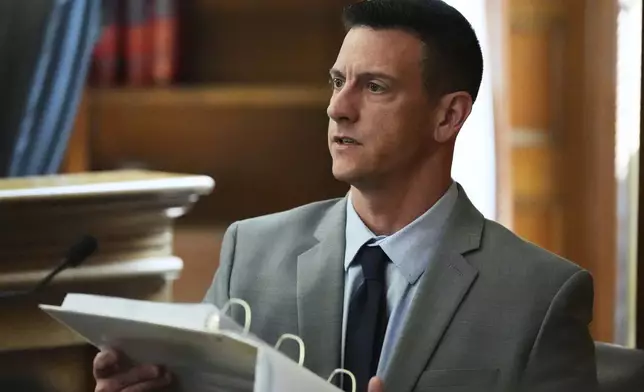 Mass. State Police detective Nicholas Guarino reviews cellular phone logs while testifying during the Karen Read trial at Norfolk Superior Court, Thursday, April 24, 2025, in Dedham, Mass. (AP Photo/Charles Krupa, Pool)