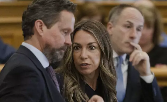 Karen Read speaks to her defense attorney Alan Jackson during her murder retrial at Norfolk Superior Court in Dedham, Mass., on Tuesday, April 29, 2025. (Libby O'Neill/The Boston Herald via AP, Pool)