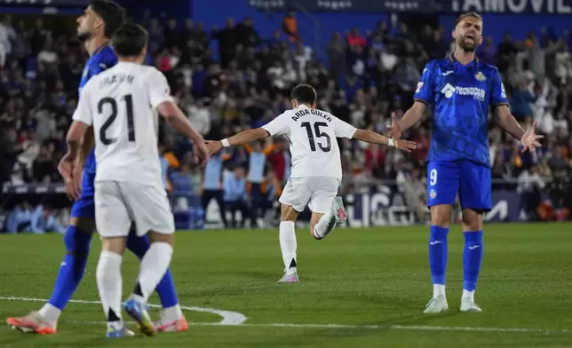 Real Madrid's Arda Guler celebrates after scoring his side's opening goal during a Spanish La Liga soccer match between Getafe and Real Madrid at the Coliseum Alfonso Perez stadium in Getafe, Spain, Wednesday, April 23, 2025. (AP Photo/Manu Fernandez)