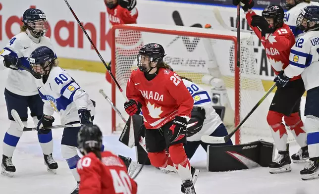Canada's Emily Clark (26) reacts after a her team scored their second goal against Finland during a Group A match at the women's ice hockey world championships, Thursday, April 10, 2025, in Ceske Budejovice, Czech Republic. (Vaclav Pancer/CTK via AP)