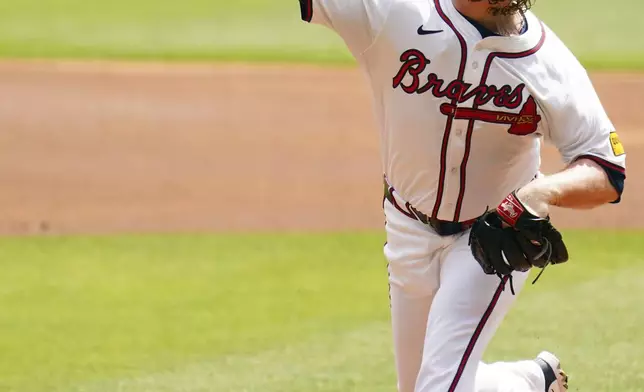 Atlanta Braves pitcher Grant Holmes (66) delivers a pitch against the Minnesota Twins during the first inning of a baseball game Saturday, April 20, 2025, in Atlanta. (AP Photo/John David Mercer)