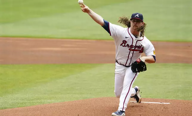 Atlanta Braves pitcher Grant Holmes (66) delivers a pitch against the Minnesota Twins during the first inning of a baseball game Saturday, April 20, 2025, in Atlanta. (AP Photo/John David Mercer)