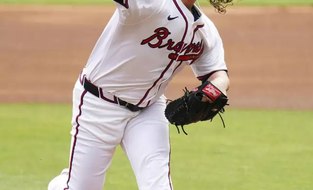 Atlanta Braves pitcher Grant Holmes (66) delivers a pitch against the Minnesota Twins during the first inning of a baseball game Saturday, April 20, 2025, in Atlanta. (AP Photo/John David Mercer)