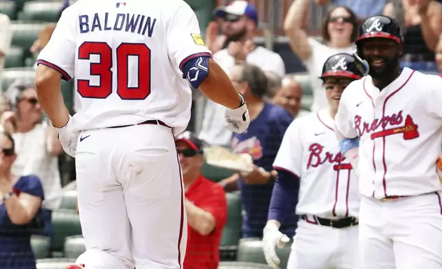Atlanta Braves' Drake Baldwin (30) celebrates his two-run home run against the Minnesota Twins during the third inning of a baseball game Saturday, April 20, 2025, in Atlanta. (AP Photo/John David Mercer)