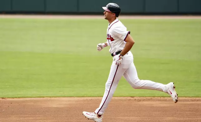 Atlanta Braves' Matt Olson (28) trots the bases on his two-run home run against the Minnesota Twins during the first inning of a baseball game Saturday, April 20, 2025, in Atlanta. (AP Photo/John David Mercer)