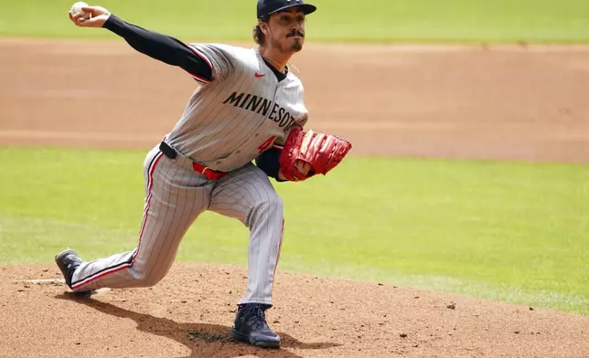 Minnesota Twins pitcher Joe Ryan (41) delivers a pitch against the Atlanta Braves during the first inning of a baseball game Saturday, April 20, 2025, in Atlanta. (AP Photo/John David Mercer)
