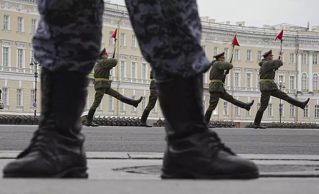 Honour guard soldiers march during a rehearsal for the Victory Day military parade, which will take place at Dvortsovaya (Palace) Square on May 9 to celebrate 80 years after the victory in World War II, in St. Petersburg, Russia, Tuesday, April 22, 2025. (AP Photo/Dmitri Lovetsky)