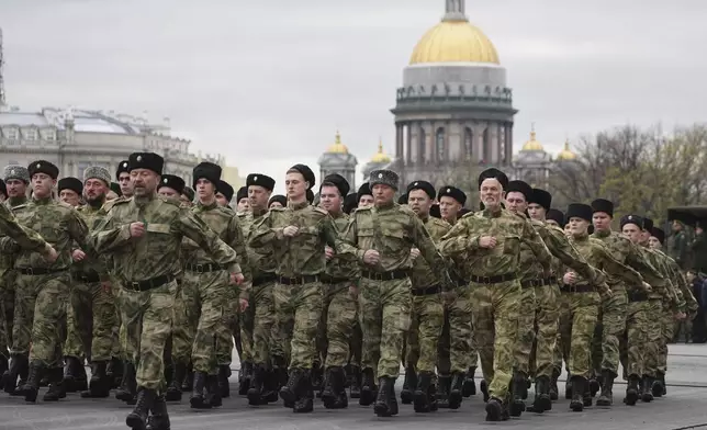 Cossacks march during a rehearsal for the Victory Day military parade, which will take place at Dvortsovaya (Palace) Square on May 9 to celebrate 80 years after the victory in World War II, in St. Petersburg, Russia, Tuesday, April 22, 2025. (AP Photo/Dmitri Lovetsky)