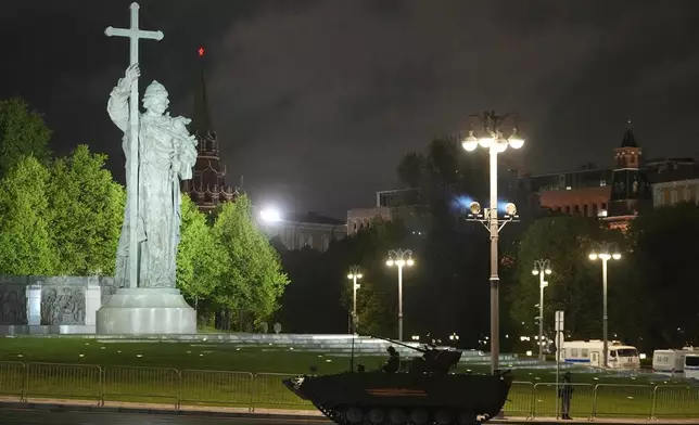 Russian BMP-1 Basurmanin infantry fighting vehicle rolls along Borovitskaya Square next to the Kremlin, after a rehearsal for the Victory Day military parade in Moscow, Russia, on Tuesday, April 29, 2025. (AP Photo/Pavel Bednyakov)