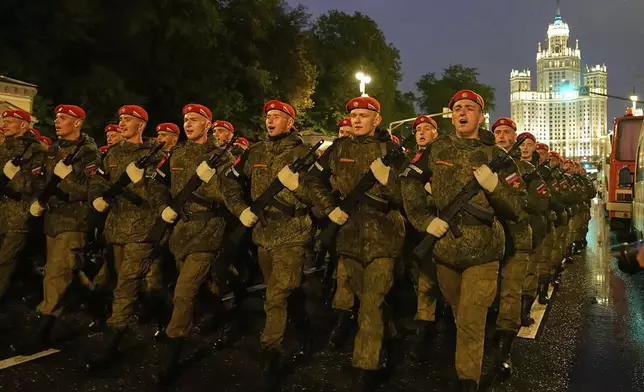 Troops march toward Red Square to attend a rehearsal for the Victory Day military parade in Moscow, Russia, on Tuesday, April 29, 2025. (AP Photo/Alexander Zemlianichenko)