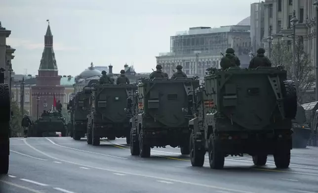 Russian military vehicles roll along Tverskaya street toward Red Square to attend a rehearsal for the Victory Day military parade in Moscow, Russia, on Tuesday, April 29, 2025. (AP Photo/Pavel Bednyakov)
