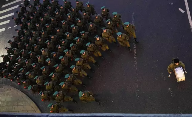 Troops march toward Red Square to attend a rehearsal for the Victory Day military parade in Moscow, Russia, on Tuesday, April 29, 2025. (AP Photo/Alexander Zemlianichenko)