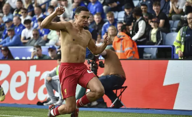 Liverpool's Trent Alexander-Arnold celebrates after scoring his side's opening goal during the English Premier League soccer match between Leicester City and Liverpool at King Power stadium in Leicester, England, Sunday, April 20, 2025. (AP Photo/Rui Vieira)