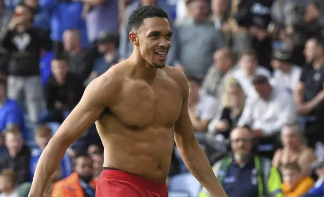 Liverpool's Trent Alexander-Arnold celebrates after scoring his side's opening goal during the English Premier League soccer match between Leicester City and Liverpool at King Power stadium in Leicester, England, Sunday, April 20, 2025. (AP Photo/Rui Vieira)
