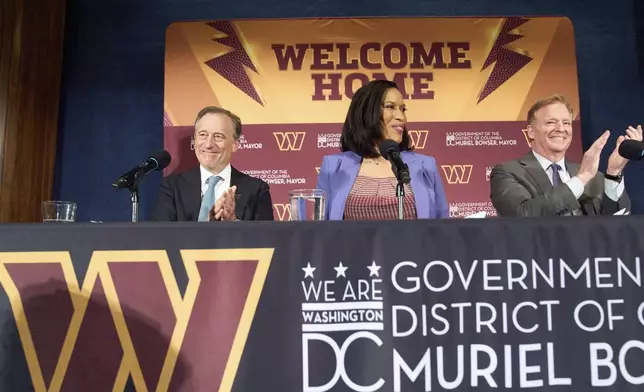 Washington Commanders controlling owner Josh Harris, from left, District of Columbia Mayor Muriel Bowser and NFL Commissioner Roger Goodell announce a new home for the NFL football team on the site of the old RFK Stadium, Monday, April 28, 2025, at the National Press Club in Washington. (AP Photo/Jacquelyn Martin)