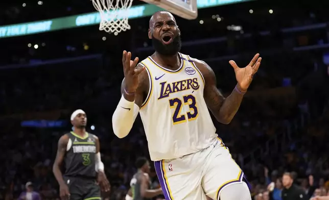 Los Angeles Lakers forward LeBron James, right, reacts after missing a pass during the first half in Game 1 of an NBA first-round playoff series against the Minnesota Timberwolves Saturday, April 19, 2025, in Los Angeles. (AP Photo/Mark J. Terrill)