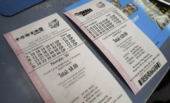 Purchased Powerball and Mega Millions tickets are shown at Mares Mart in Chicago, Sunday, April 6, 2025. (AP Photo/Nam Y. Huh)