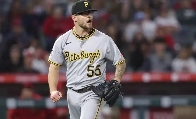 Pittsburgh Pirates pitcher Chase Shugart (55) reacts after a strikeout during the sixth inning of a baseball game against the Los Angeles Angels in Anaheim, Calif., Tuesday, April 22, 2025. (AP Photo/Jessie Alcheh)