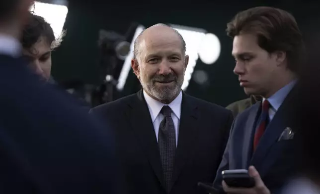 Commerce Secretary Howard Lutnick leaves after doing a television interview outside the White House, Wednesday, April 2, 2025, in Washington. (AP Photo/Mark Schiefelbein)