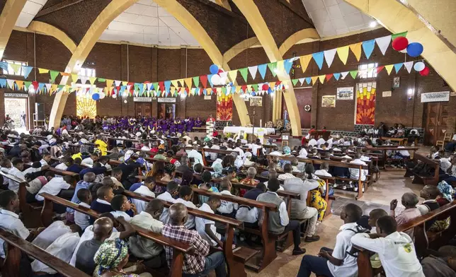 Parishioners attend a mass in honour of the late Pope Francis at the Catholic Church in Goma, Democratic Republic of Congo, Saturday, April 26, 2025. (AP Photo/Moses Sawasawa)