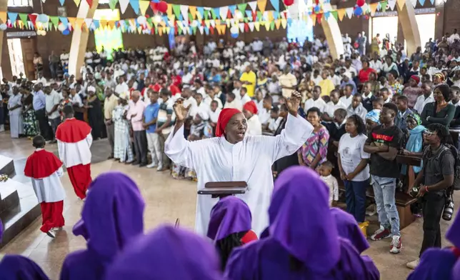 Parishioners attend a mass in honour of the late Pope Francis at the Catholic Church in Goma, Democratic Republic of Congo, Saturday, April 26, 2025. (AP Photo/Moses Sawasawa)