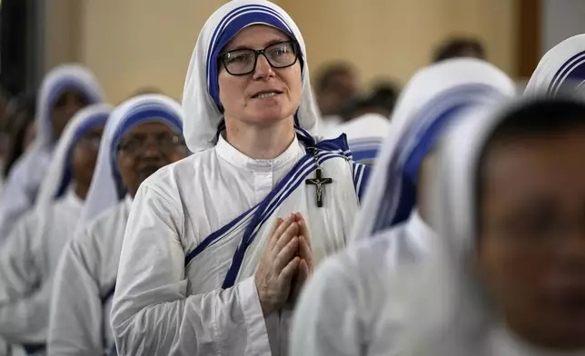 Catholic nuns of the Missionaries of Charity, the order founded by Saint Teresa, attend a service for the late Pope Francis at the Cathedral of The Most Holy Rosary, in Kolkata, India, Saturday, April 26, 2025. (AP Photo/Bikas Das)