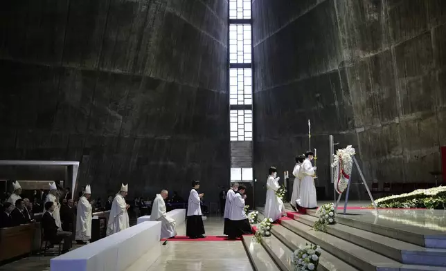 Priests start a memorial Mass for the late Pope Francis at St. Mary's Cathedral in Tokyo, Sunday, April 27, 2025. (AP Photo/Hiro Komae, Pool)