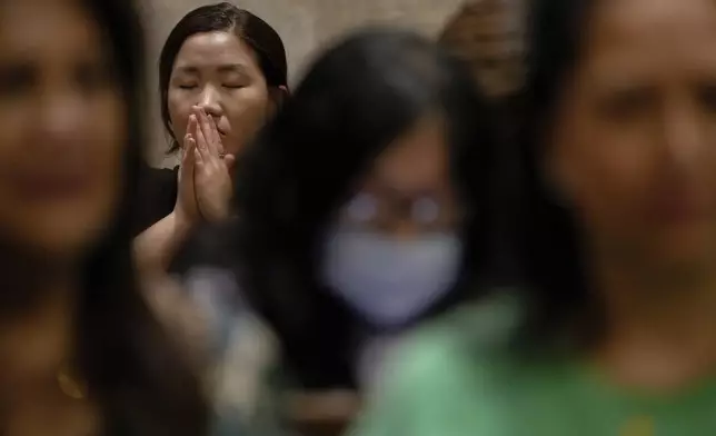 A parishioner prays during a memorial mass for the late Pope Francis at St. Patrick's Cathedral, Saturday, April 26, 2025, in New York. (AP Photo/Julia Demaree Nikhinson)