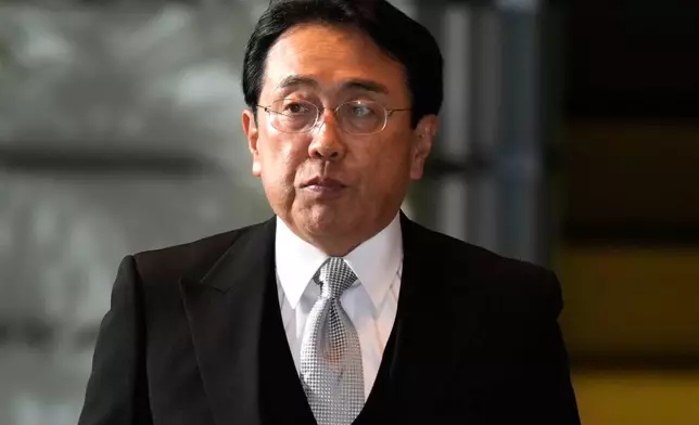FILE - Ryosei Akazawa, newly appointed Minister in charge of Economic Revitalization, arrives at the prime minister's office Tuesday, Oct. 1, 2024, in Tokyo. (AP Photo/Hiro Komae)