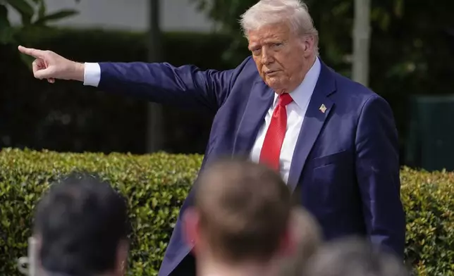President Donald Trump gestures to the crowd as he departs after welcoming the 2025 College Football National Champions, the Ohio State University football team, during an event on the South Lawn of the White House, Monday, April 14, 2025, in Washington. (AP Photo/Manuel Balce Ceneta)