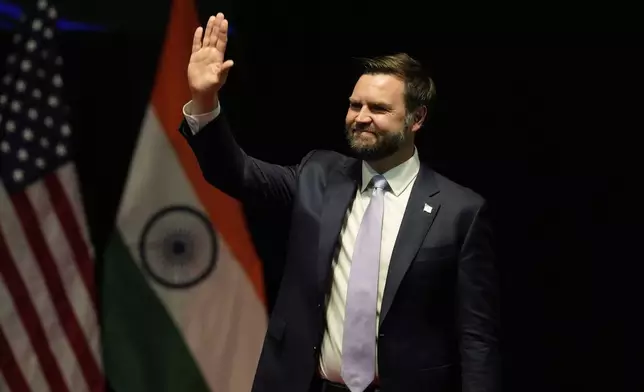 U.S. Vice President JD Vance waves at the audience after speaking at the Rajasthan International Center in Jaipur, India, Tuesday, April 22, 2025. (AP Photo/Manish Swarup)