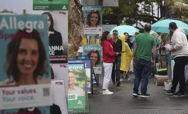 People arrive at a polling place as early voting begins in Sydney, Tuesday, April 22, 2025, for a national election to be held on May 3. (AP Photo/Mark Baker)