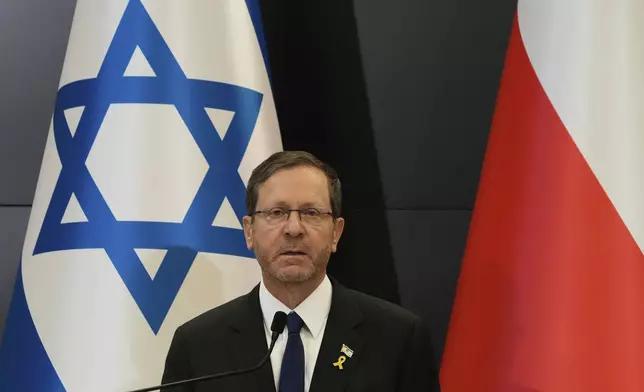 Israel's President Isaac Herzog holds a statement to media in Oswiecim, Poland, Thursday, April 24, 2025. (AP Photo/Czarek Sokolowski)