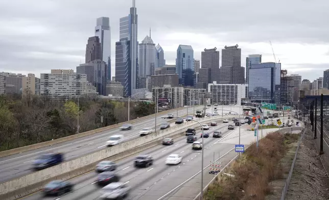 FILE - Motor vehicle traffic moves along the Interstate 76 highway in Philadelphia, Wednesday, March 31, 2021. (AP Photo/Matt Rourke, File)