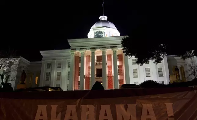 FILE - Festive banners and bunting hang from and around the Alabama Capitol early Jan. 16, 2011. (AP Photo/Dave Martin, File)