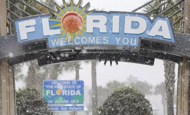FILE - Heavy snow falls onto the Florida Welcome Center on Jan. 21, 2025 in Pensacola, Fla. (Luis Santana /Tampa Bay Times via AP, File)