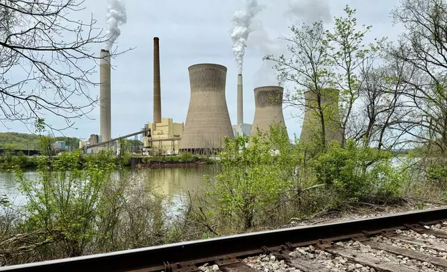 American Electric Power's John Amos coal-fired plant in Winfield, W.Va, is seen from the town of Poca across the Kanawha River, Tuesday, April 22, 2025. (AP Photo/John Raby)