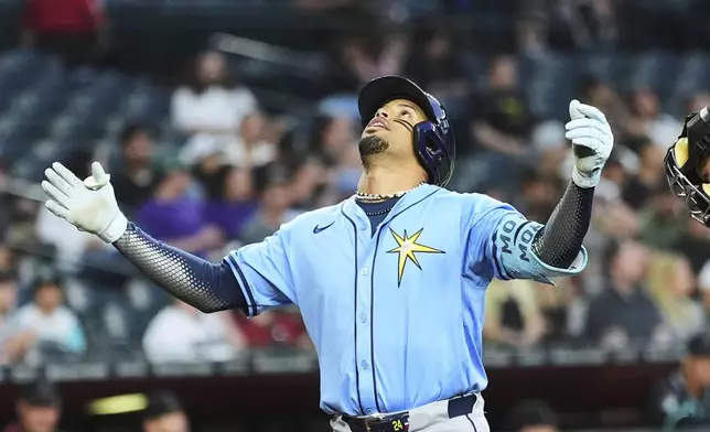 Tampa Bay Rays' Christopher Morel looks up as he celebrates his home run against the Arizona Diamondbacks during the second inning of a baseball game Wednesday, April 23, 2025, in Phoenix. (AP Photo/Ross D. Franklin)