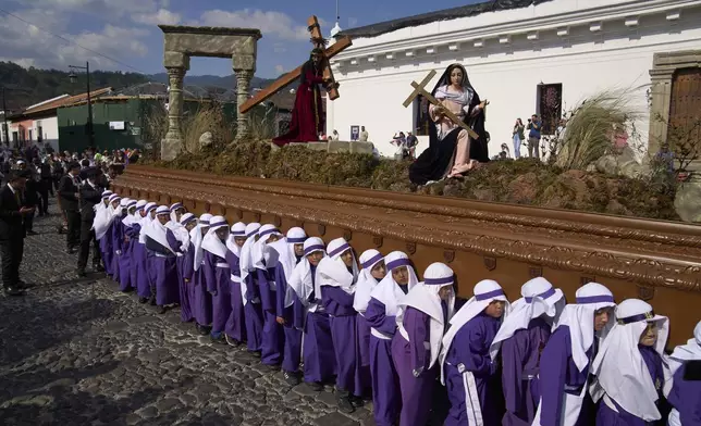 Children carry an image of Jesus Christ at a Holy Week procession in Antigua, Guatemala, Wednesday, April 16, 2025. (Moises Castillo)