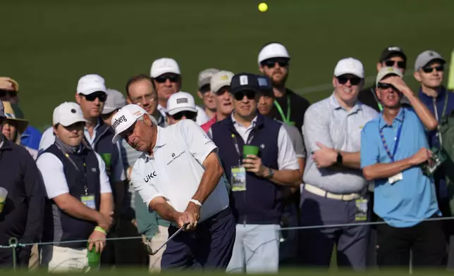 Fred Couples chips to the green on the second hole during the first round at the Masters golf tournament, Thursday, April 10, 2025, in Augusta, Ga. (AP Photo/George Walker IV)